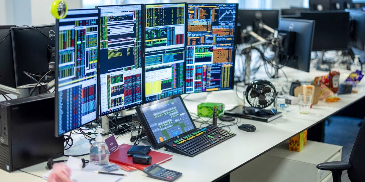 A trader's desk at the office of of Singer Captial Markets in London, U.K. on Monday, Aug. 2, 2021. A survey this month showed that just 17% of Londons white-collar workers want a full-time return, and many said itd take a pay rise to get them back five days a week. Photographer: Jason Alden/Bloomberg via Getty Images